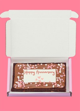 <p>Introducing the baked delights of Simply Cake Co: the perfect treats to make an occasion extra special (and sweet), delivered directly through your loved one's letterbox!</p>
<p>Why just send a card when you can send your other half a mind-blowingly good brownie as well? Treat your loved one with a super gooey, sharing-size slab of chocolate brownie and this anniversary will definitely be a special one. Hopefully they'll even share some with you 'cos that's love right? This indulgent brownie slab is topped with real Belgian chocolate, pink heart-shaped sprinkles and an edible 'Happy Anniversary' design for the finishing touch!</p>
<p>These are handmade in the UK with the best ingredients including proper butter, free-range eggs, Belgian chocolate AND gluten free flour so that more people can enjoy their great taste!. Simply Cake Co. baked goods&nbsp;are packed full of chocolate, which gives them a shelf life of a good 10 days on arrival. Keep them wrapped up tight, or freeze if you want to keep them longer! Serves 4.</p>
<p><strong>Please note that this product is fulfilled by our partner Simply Cake Co. and therefore will be sent separately to our other cards and gifts.</strong></p>
<p>Ingredients:</p>
<p>Caster sugar, Chocolate (Cocoa mass, Sugar, Cocoa butter, whole<strong>&nbsp;MILK</strong>&nbsp;powder, emulsifier&nbsp;<strong>SOY</strong>&nbsp;Lecithin, Natural Vanilla flavouring), White Chocolate (Sugar, Cocoa butter, whole&nbsp;<strong>MILK</strong>&nbsp;powder, emulsifier<strong>&nbsp;SOY&nbsp;</strong>Lecithin, Natural Vanilla flavouring), Butter (<strong>MILK</strong>), free-range&nbsp;<strong>EGG</strong>, gluten-free flour blend (pea, rice, potato, tapioca, maize, buckwheat), cocoa powder, salt, xanthan gum, sprinkles (Sugar, potato starch, sunflower oil, rice flour. Colours; concentrate of carrot, blueberry, radish, safflower, apple, blackcurrant, Glazing agent; carnauba wax, Hypromellose, Lemon Powder, Vegetable Fat (Rice Bran Oil), Colours (E160c Paprika, E163 Anthocyanins, E171 Titanium Dioxide), Anti-caking agent (Potassium Aluminium Silicate))), wafer paper (Potato Starch, Water, Olive Oil, maltodextrin) icing (Water, starch (maize), dried glucose syrup, humectant: glycerine, sweetner: sorbitol, colour: titanium dioxide, vegetable oil (rapeseed), thickener: cellulose, emulsifier: polysorbate 80 flavouring, vanillin, sucralose), colourings(water, humectant, E1520, E422, food colouring ( e120, e122, acidity regulator e330, e151, e110, e102).</p>
<p><strong>For allergens please see above in bold.</strong>&nbsp;Made in a bakery that handles&nbsp;<strong>MILK, EGGS, SOYA, NUTS &amp; PEANUTS</strong>&nbsp;therefore may contain traces. Coeliac-friendly. Not suitable for vegetarians.</p>